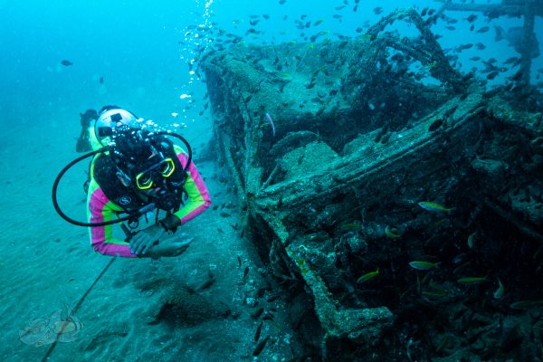 scuba diving person found old car in deep sea