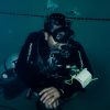 scuba expert doing scuba diving in Pondicherry clicking an underwater photo with OLYMPUS DIGITAL CAMERA at temple adventure Technical fun dive